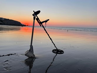 Metal Detector on beach, finding lost treasures